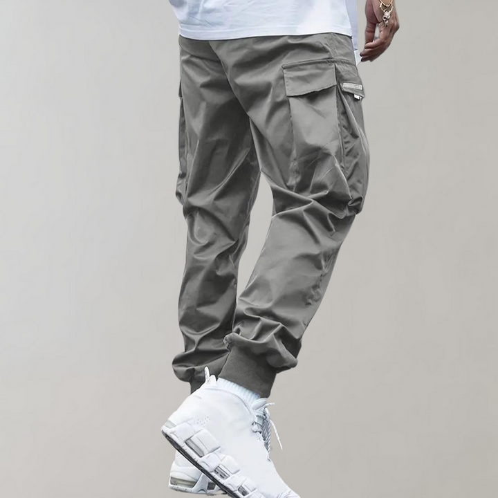 Alpenfeld | Herren Cargo Jogginghose – Lila Streetwear-Hose mit Reißverschlusstaschen & Bündchen